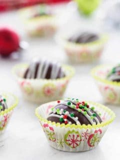 Chocolate Peanut Butter Balls make a festive treat the whole family will love! Holiday sprinkles make them extra festive!