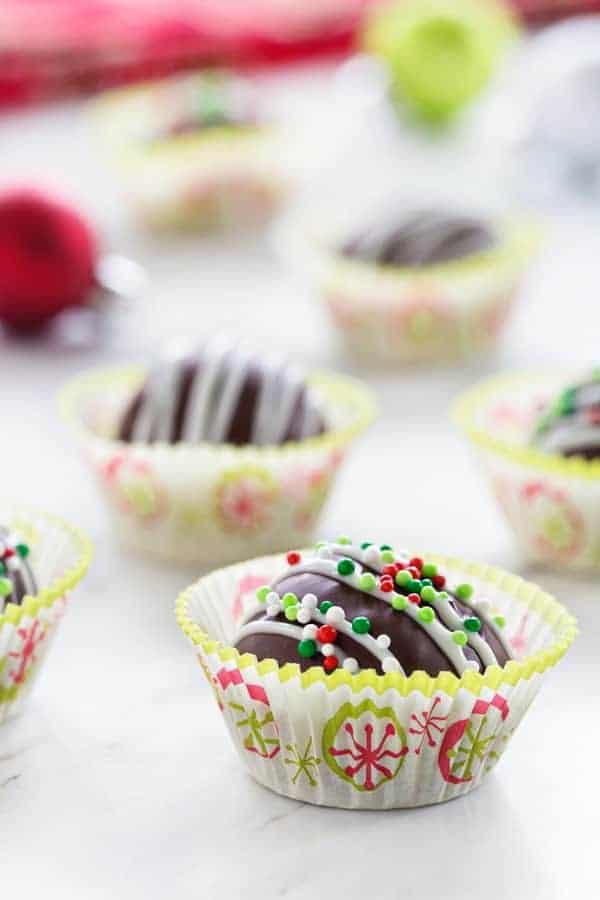 Chocolate Peanut Butter Balls make a festive treat the whole family will love! Holiday sprinkles make them extra festive!