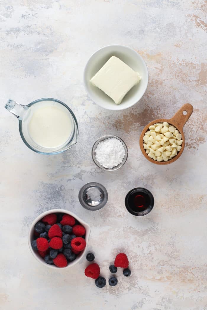Ingredients for white chocolate mousse arranged on a countertop.
