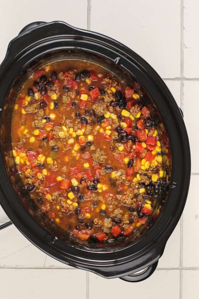Taco soup in a slow cooker, ready to be cooked