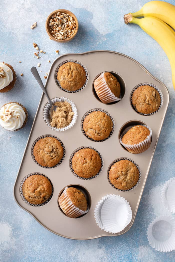 Baked, unfrosted banana cupcakes set in a muffin tin