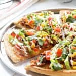 Taco Pizza Pie will make any kid and adult totally happy. A great weeknight dinner when you need something fast and satisfying!