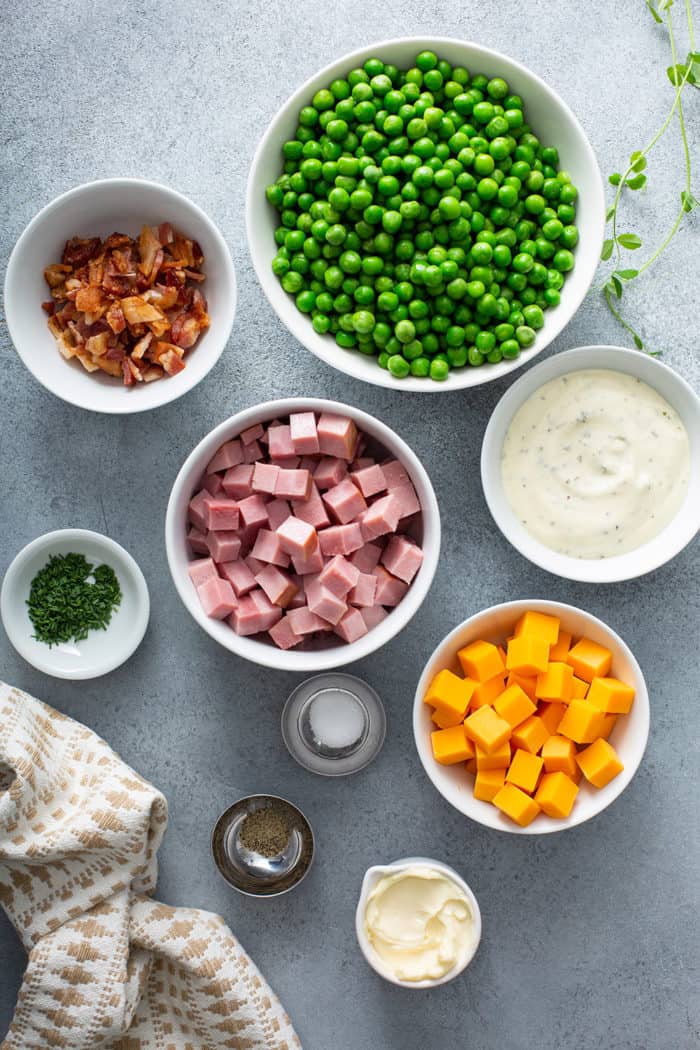 Ingredients for Amish Pea Salad arranged on a gray countertop