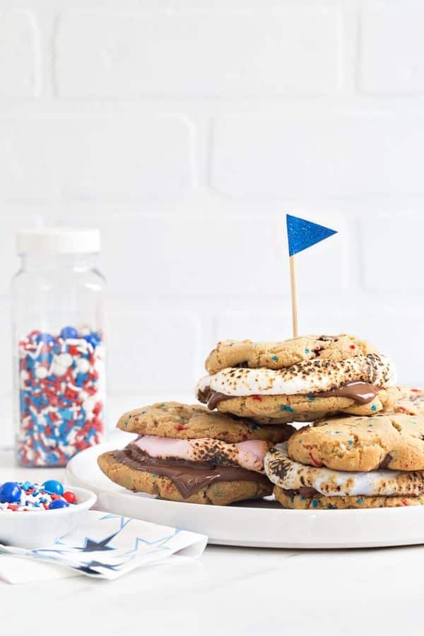 Chocolate Chip Cookie S'mores are loaded with dark chocolate chips and festive sprinkles and then topped with roasted marshmallows and more chocolate. Simple, delicious and perfect for summer!