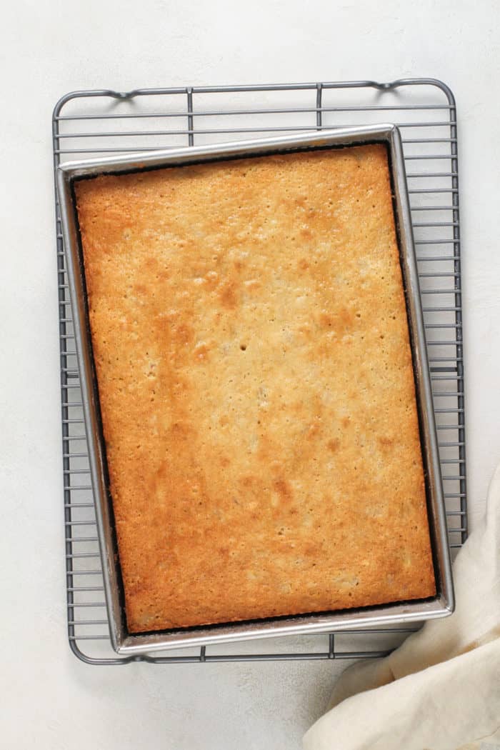 Baked and cooled banana cake on a wire rack.