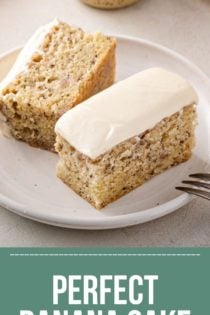 Halved slice of banana cake on a white plate. A fork is perched on the edge of the plate. text overlay includes recipe name.