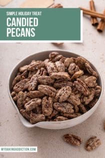 Close up of candied pecans in a white bowl. Text overlay includes recipe name.
