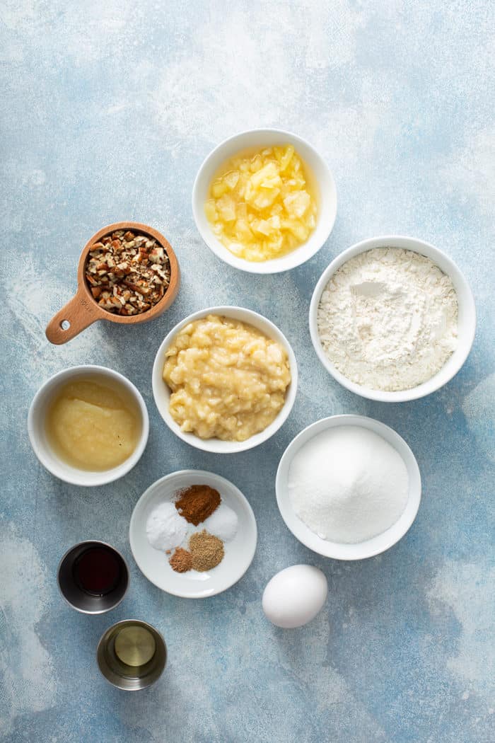 Ingredients for hummingbird cupcakes arranged on a blue countertop