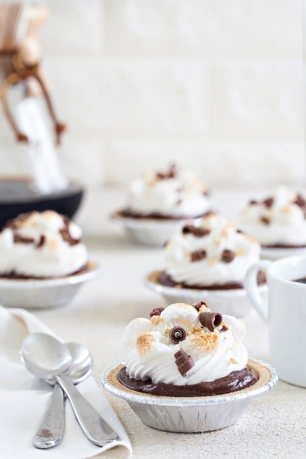 Mini S'mores Pies come together in less than 10 minutes and are the perfect no-bake dessert for summer. 