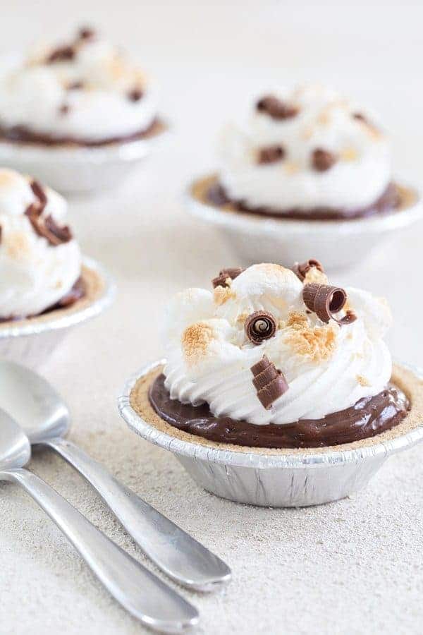Mini S'mores Pies come together in less than 10 minutes and are the perfect no-bake dessert for summer.  Ooey-gooey goodness!