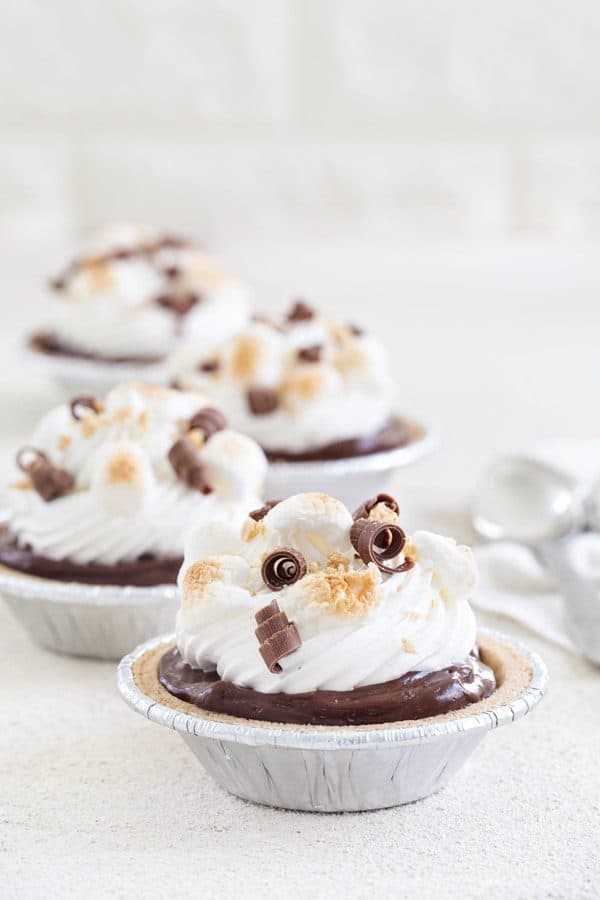 Mini S'mores Pies come together in less than 10 minutes and are the perfect no-bake dessert for summer.  So easy and so delish!