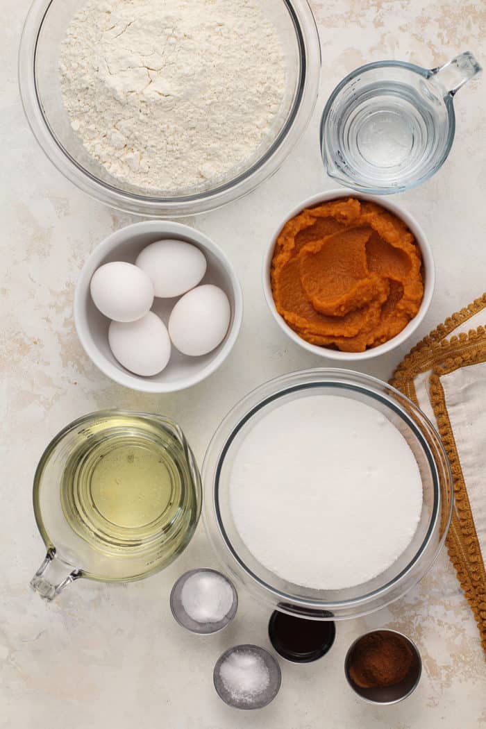 Ingredients for pumpkin bread arranged on a countertop