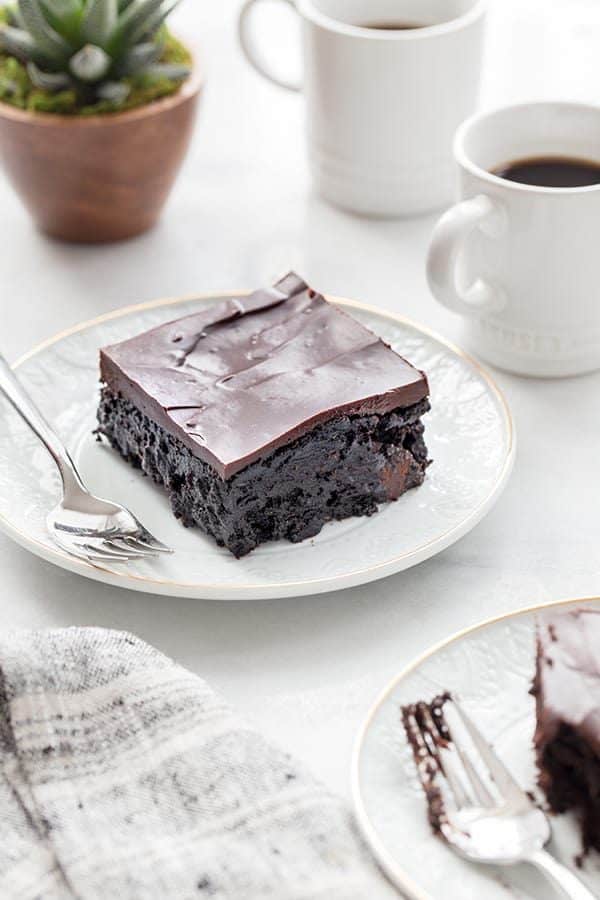Chocolate Zucchini Cake is rich, ultra-moist and the perfect cake for the chocolate lover in your life. Serve it up with a mug of your favorite coffee!