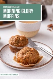 Two morning glory muffins on a plate with a mug of coffee in the background. Text overlay includes recipe name.
