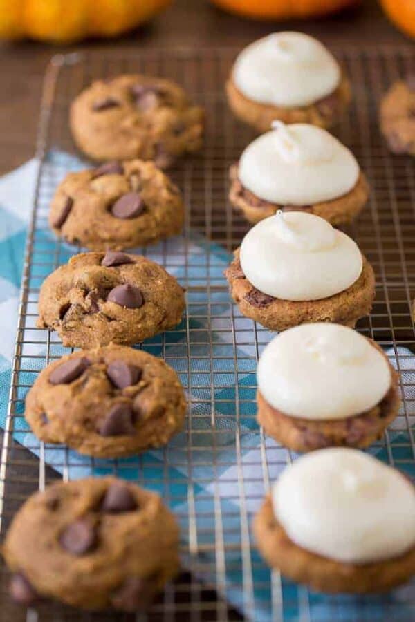 Pumpkin Whoopie Pies are made with fluffy pumpkin chocolate chip cookies and cream cheese filling to create a delicious dessert for any fall party!