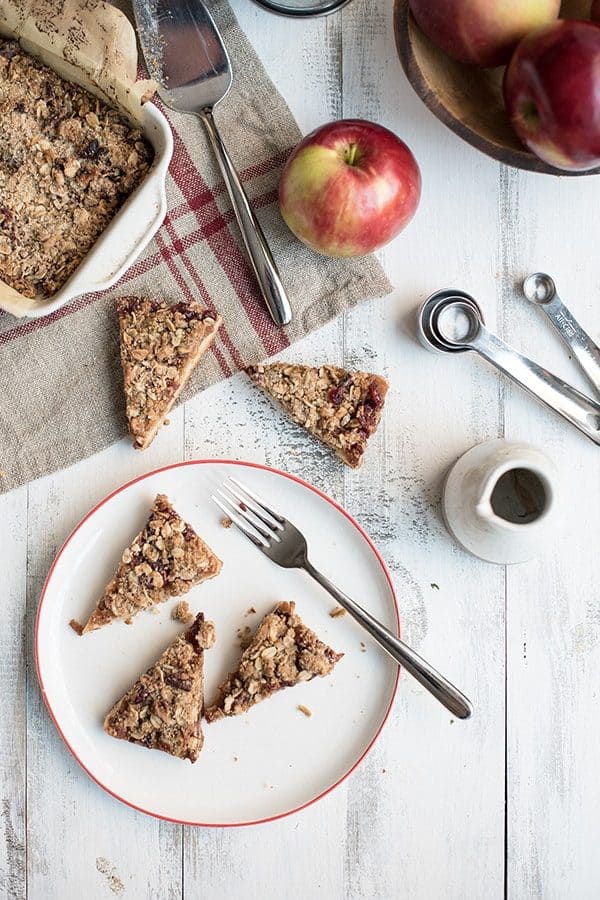 Apple Cranberry Crumble Bars are a sweet and crunchy treat that celebrates the fall season. Perfect for breakfast or dessert!