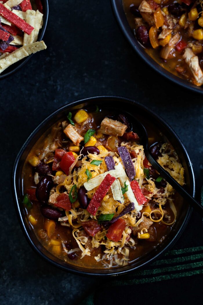 Easy Chicken Chili is so simple! Rotisserie chicken, tomatoes, corn, and beans are simmered with your favorite chili spices for a total win at dinner time.
