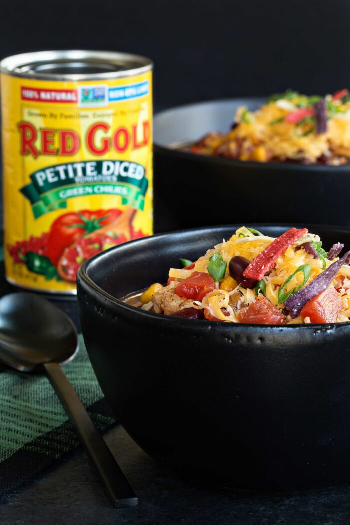 Easy Chicken Chili is so simple! Rotisserie chicken, tomatoes, corn, and beans are simmered with chili spices for a simple and delicious weeknight meal!