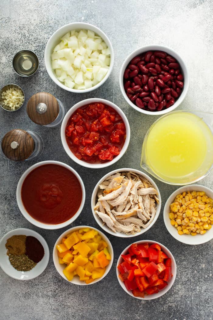 Easy chicken chili ingredients arranged on a gray countertop