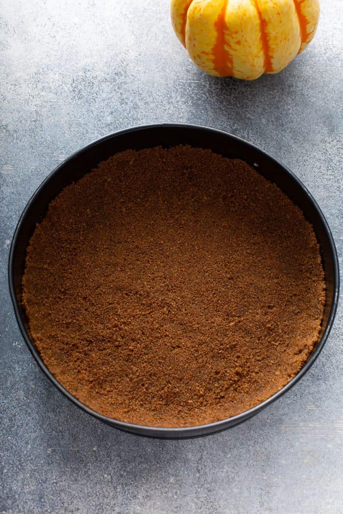 Gingersnap cookie crust in a springform pan