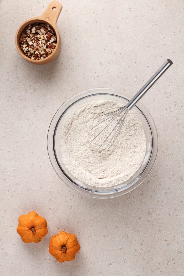 Pumpkin pancake dry ingredients in a glass mixing bowl.