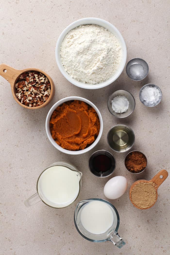 Pumpkin pancake ingredients arranged on a countertop.