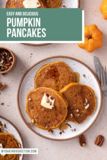 Overhead view of three plates of pumpkin pancakes, topped with butter and syrup. Text overlay includes recipe name.