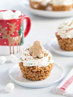 Gingerbread Marshmallow Treat Cupcakes are an adorable and delicious addition to any holiday dessert plate! Festive sprinkles make and mini gingerbread marshmallows make them merry and bright