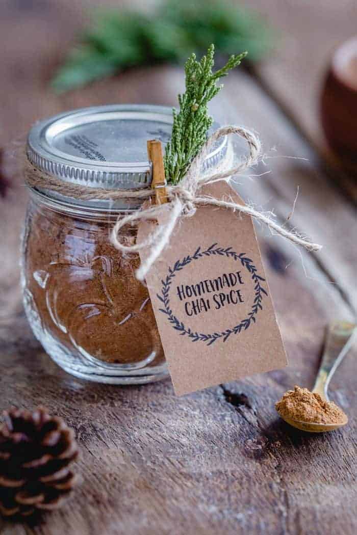 This homemade Chai Spice Blend is the perfect warm and cozy spice mixture for the holiday season.  Add a cute tag, twine and little greenery for a super simple hostess gift!