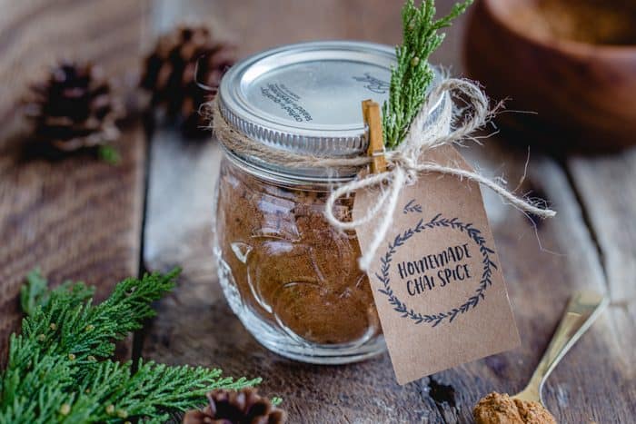 This homemade Chai Spice Blend is the perfect warm and cozy spice mixture for the holiday season.  Add a cute tag, twine and little greenery an easy and thoughtful handmade gift!