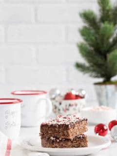 Chocolate Peppermint Scotcheroos are a fun and festive spin on a classic no-bake dessert. Chocolate hazelnut spread, dark chocolate chips, and crushed candy canes make them extra special!