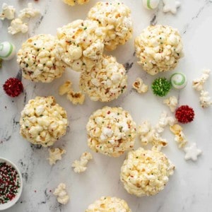 popcorn balls scattered on a marble countertop