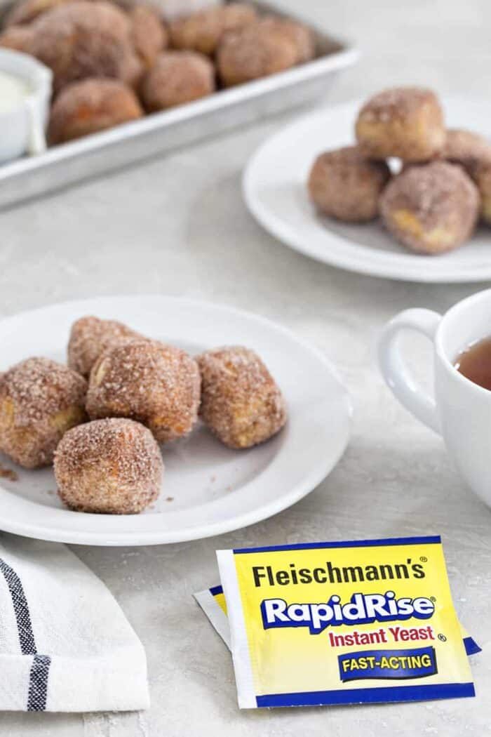 Cinnamon Sugar Soft Pretzel Bites are so easy to make at home! You'll love them served up with a side of sweet cream cheese icing! Sweet and delicious!