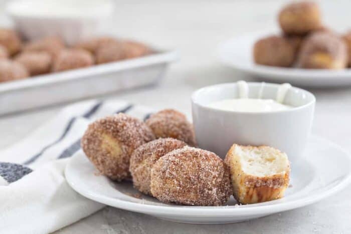 Cinnamon Sugar Soft Pretzel Bites are so easy to make at home! You'll love them served up with a side of sweet cream cheese icing! Yummy! 
