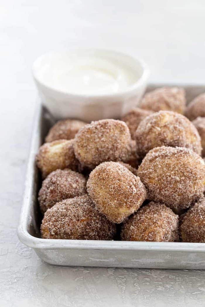 Cinnamon Sugar Soft Pretzel Bites are super simple to make. Serve them up with a side of cream cheese icing for the ultimate game day snack! So fun!