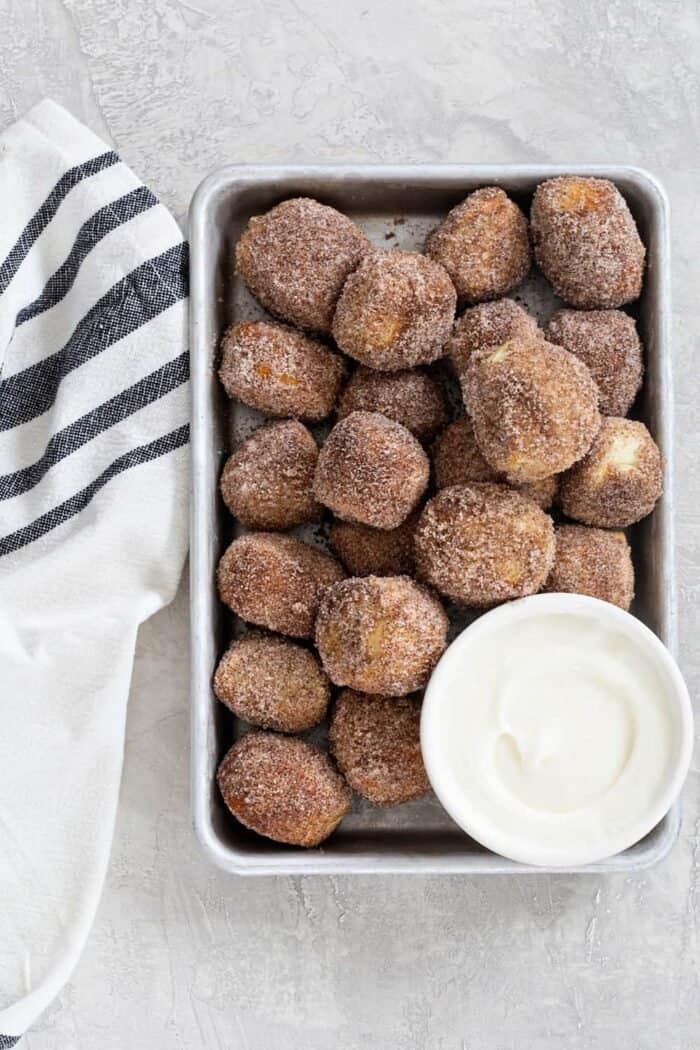 Cinnamon Sugar Soft Pretzel Bites are super simple to make. Serve them up with a side of cream cheese icing for the ultimate dessert!