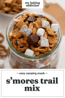 Large glass jar filled to the top with s'mores trail mix. Text overlay includes recipe name.
