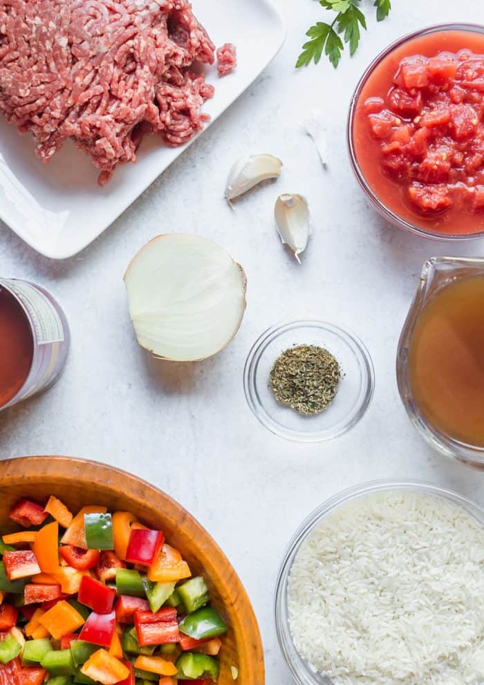 Ingredients for stuffed pepper soup arranged on a white counter