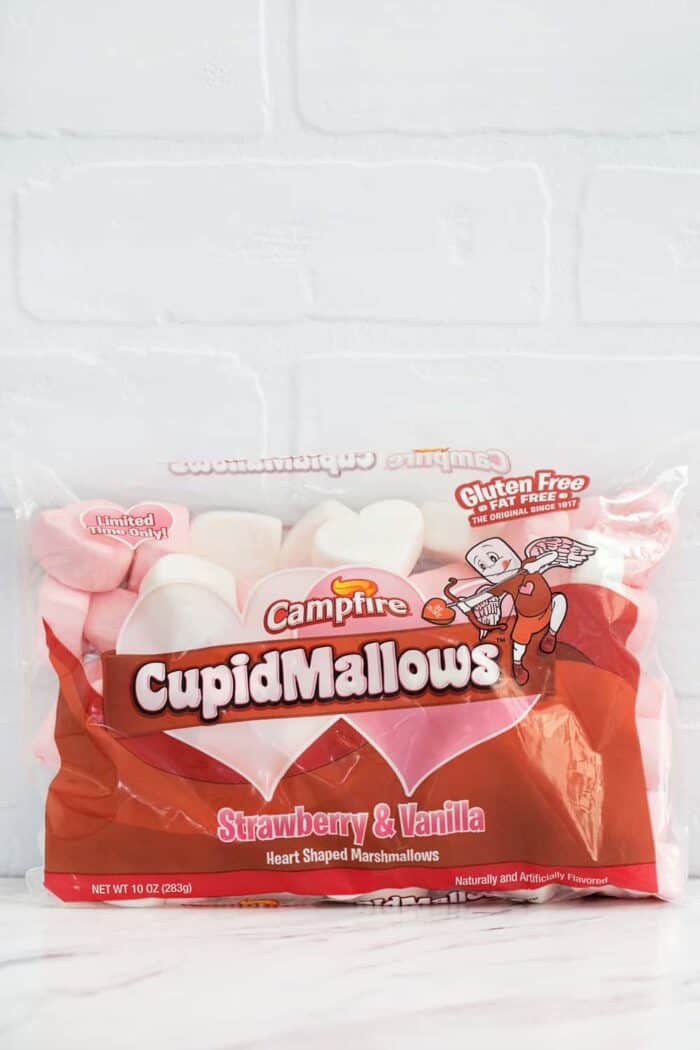 Valentine Marshmallow Cupcakes are a simple and delicious dessert for your sweetie! A sparkly CupidMallow marshmallow heart makes them extra love-ly!
