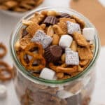 s'mores trail mix in a large glass jar.