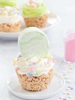 Marshmallow Treat Cupcakes are an adorable and delicious addition to any spring party! Festive sprinkles and colorful marshmallows make them extra special