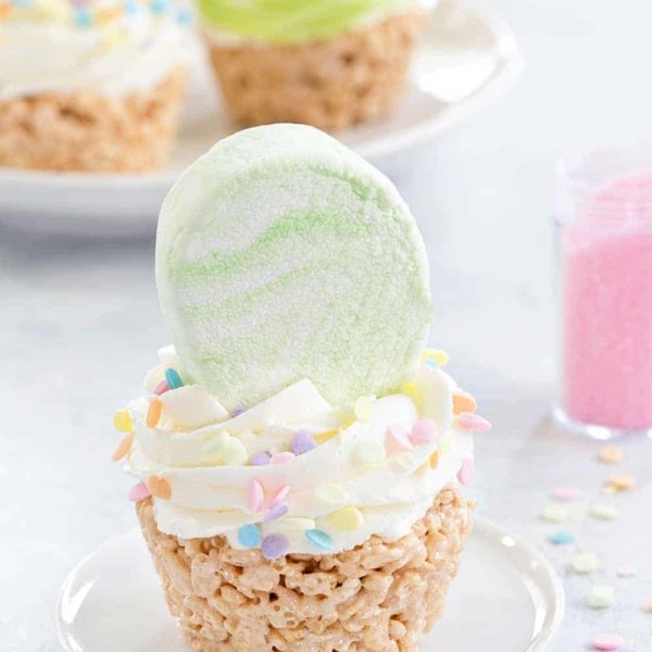 Marshmallow Treat Cupcakes are an adorable and delicious addition to any spring party! Festive sprinkles and colorful marshmallows make them extra special
