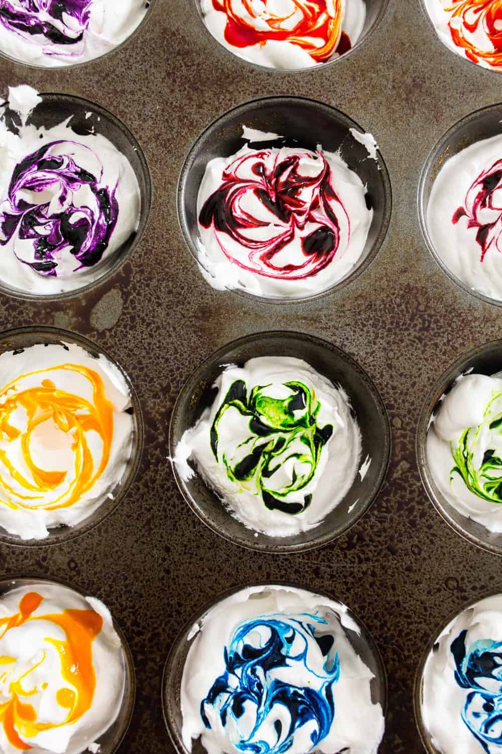 Whipped Cream Dyed Eggs are super simple and so much fun. Use a cupcake pan to keep the colors separated or swirl them together for a beautiful effect!