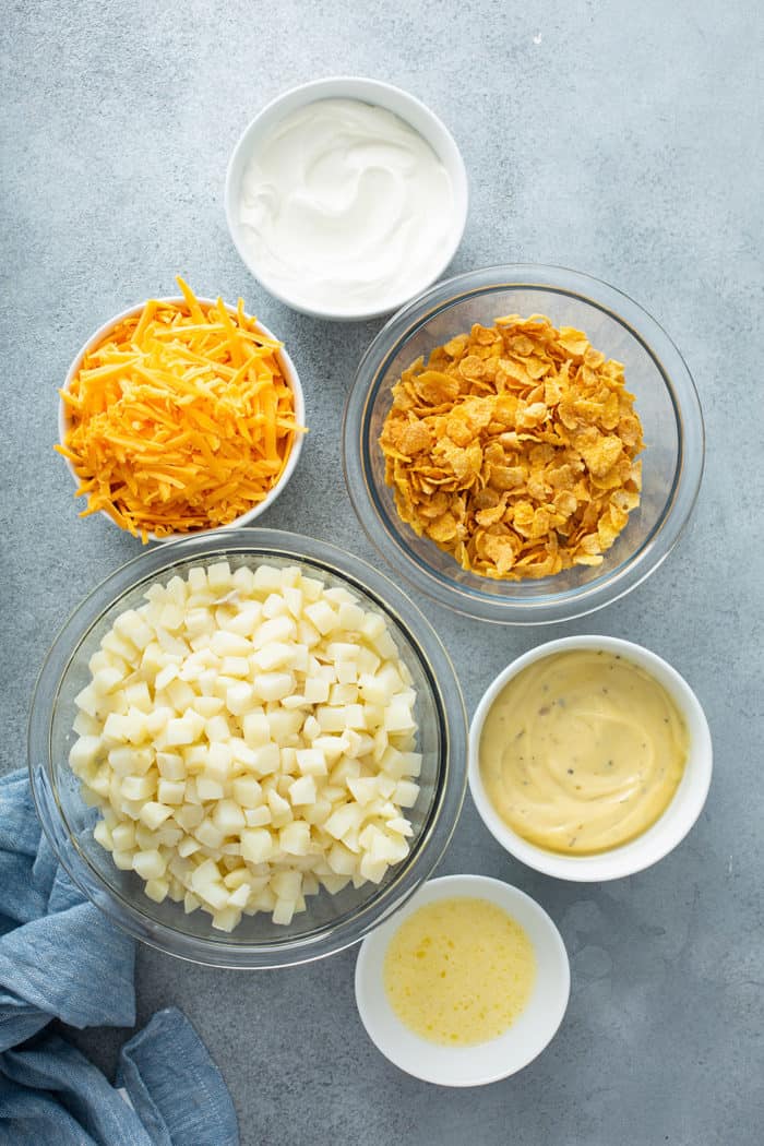 Ingredients for hash brown potatoes on a gray countertop