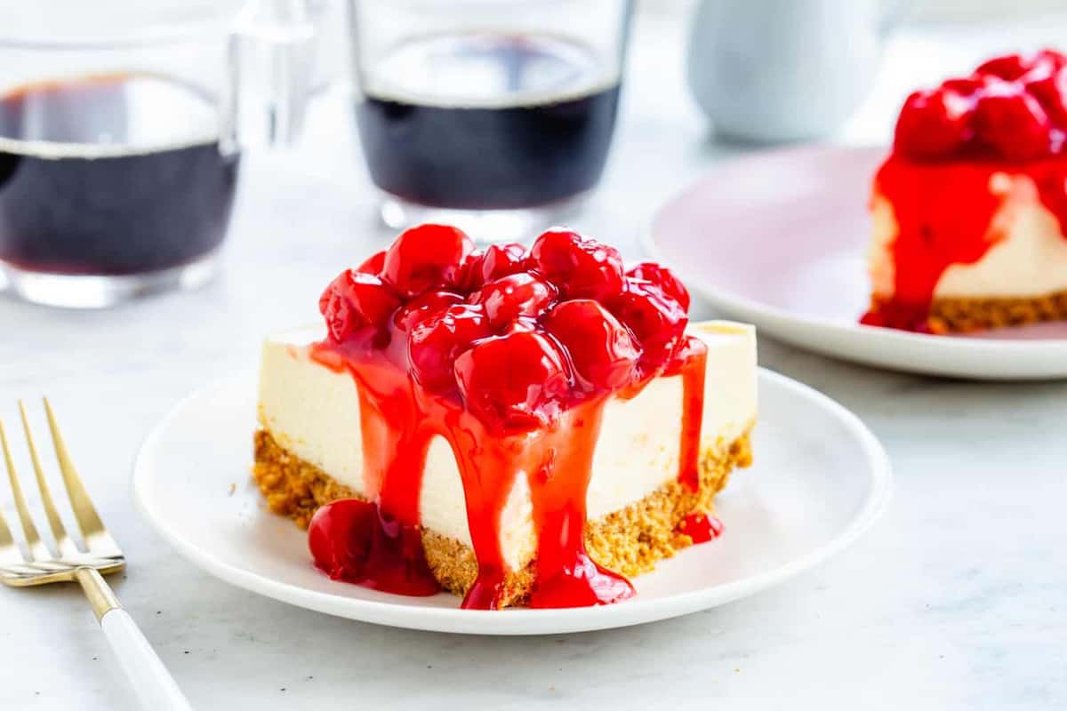 Instant Pot Cheesecake with a traditional graham cracker crust and finished with canned cherries.