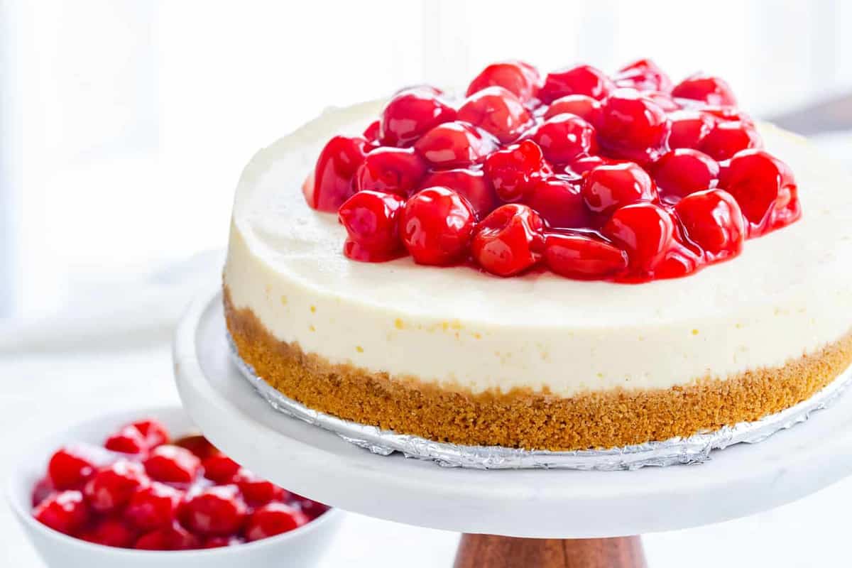 Instant Pot Cheesecake topped with cherries. Easy and delicious.