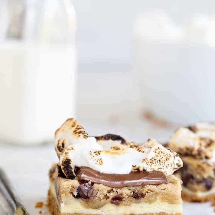 Cookie Dough Cheesecake S'mores combine all the flavor of cheesecake, chocolate chip cookie dough AND s'mores into seriously incredible dessert! You gotta try them!