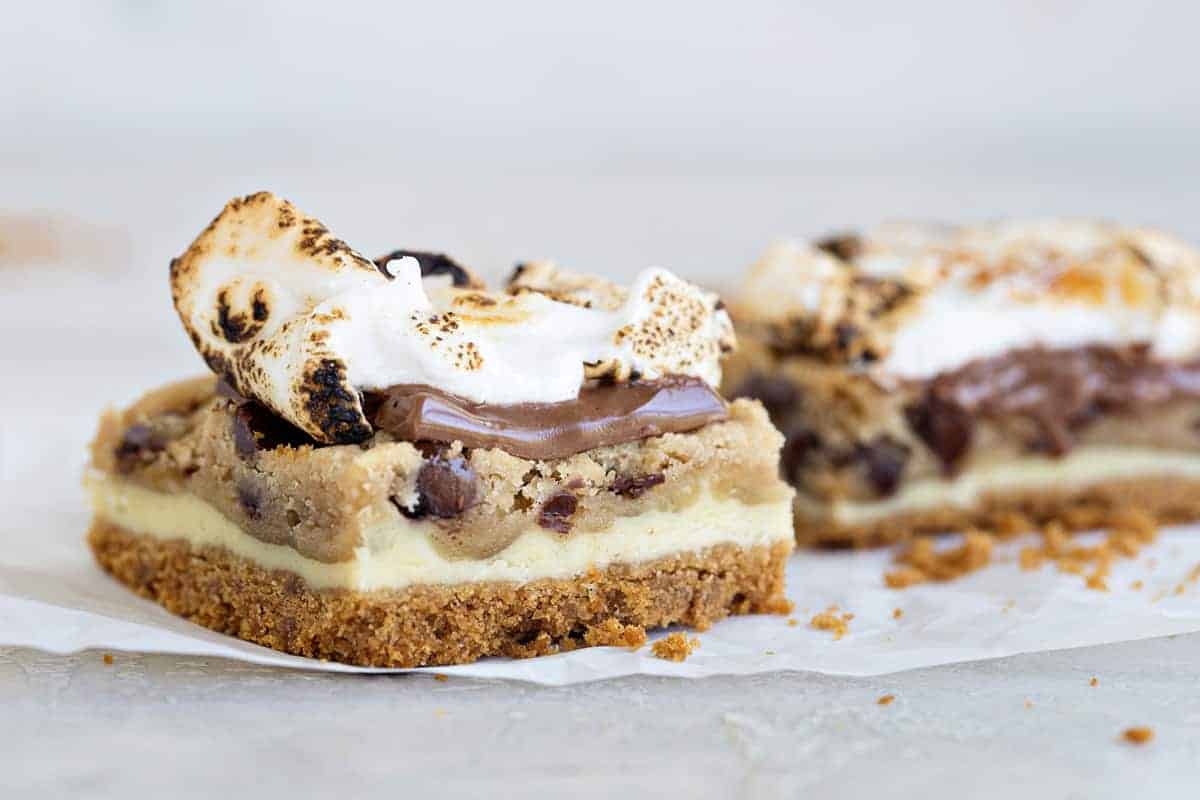 Cookie Dough Cheesecake S'mores combine all the flavor of cheesecake, chocolate chip cookie dough AND s'mores into seriously incredible dessert!  Summer perfection.