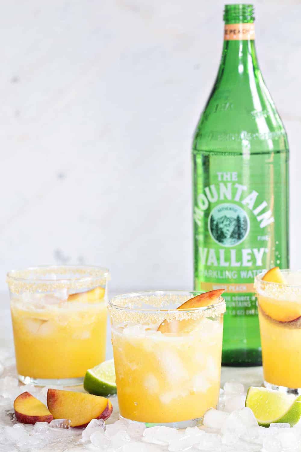 Sparkling Peach Margaritas are going to be your new favorite cocktail for summer entertaining. They're fresh, fruity and totally delish!