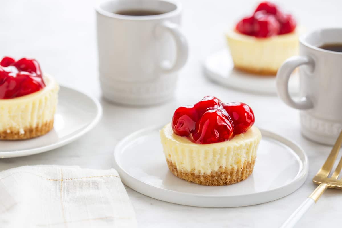 Mini Cherry Almond Cheesecakes are simple and totally adorable. Perfect for entertaining, or a simple weeknight treat!